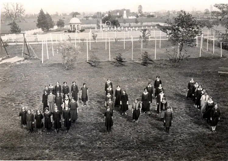 (SMI) students grotto and cemetery in the background