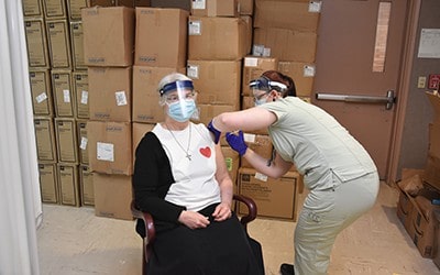 Sister Josephine receives COVID-19 vaccine