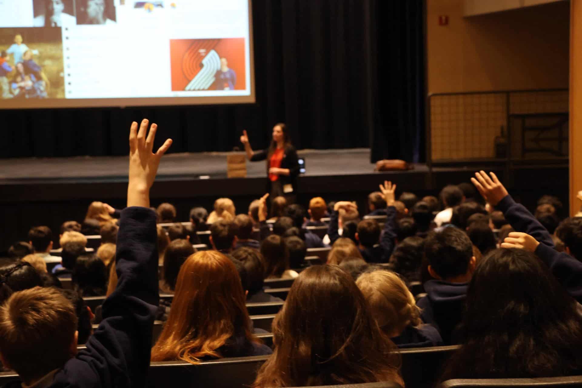 Women in STEM alumni in auditorium