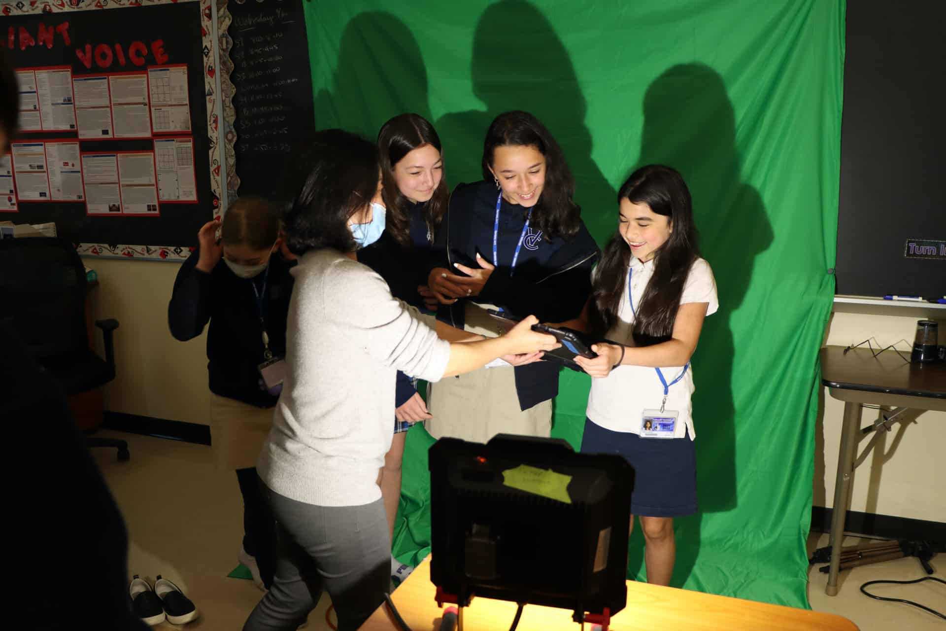 STEM students in front of a green screen