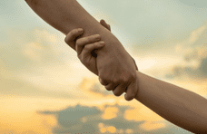 Honoring the Giving Season by Supporting Students and Families; two hands holding on to each other