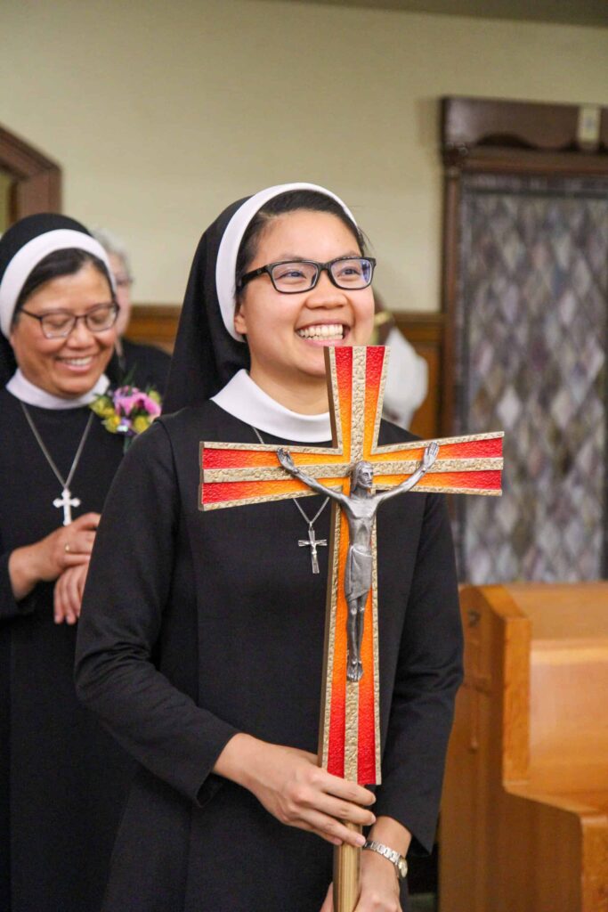 Sister thanh with a cross