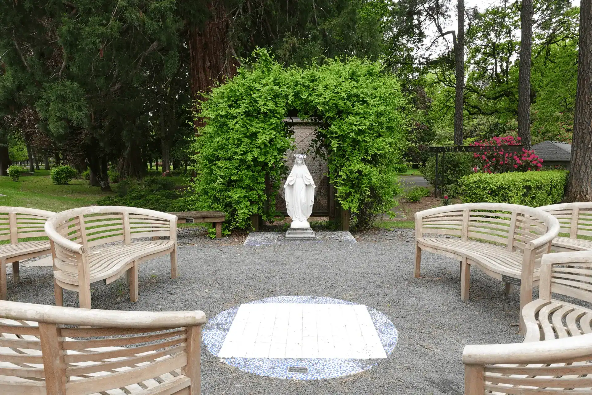 Courtyard View Mary Statue with benches surrounding