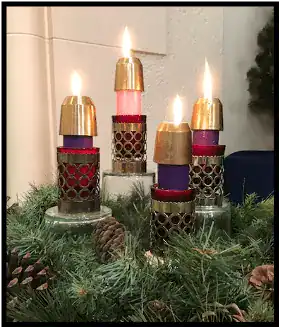 Advent candles, there are three purple candles representing hope, peace, and love, and one pink candle for joy