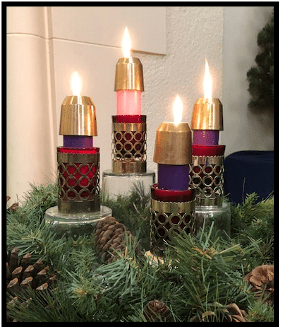 Advent candles, there are three purple candles representing hope, peace, and love, and one pink candle for joy