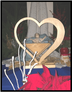 Nativity scene with a heart around baby Jesus
