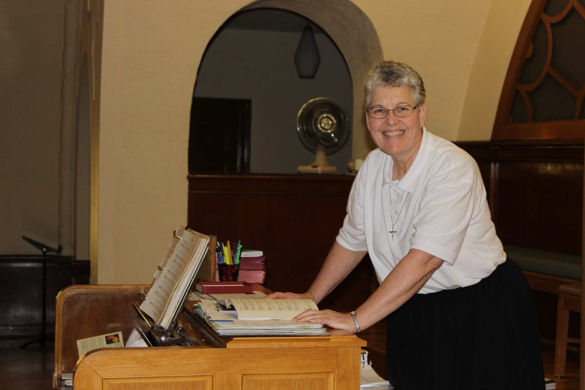 Sister Denise Klaas preparing music for Mass