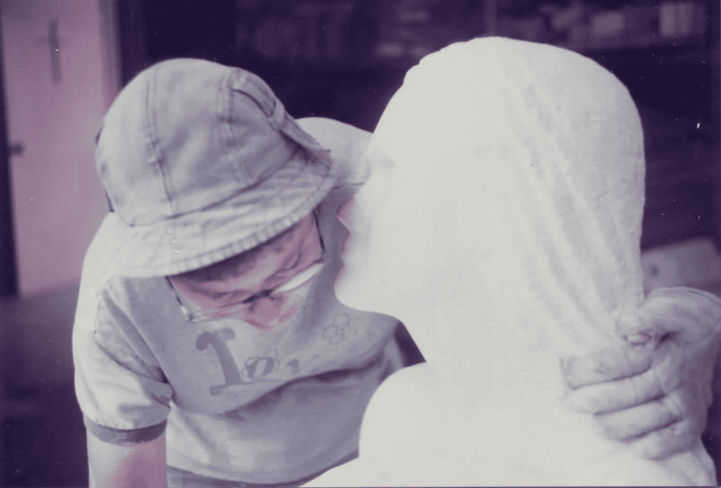 Barbara Hertel sculpting Mary statue 1984