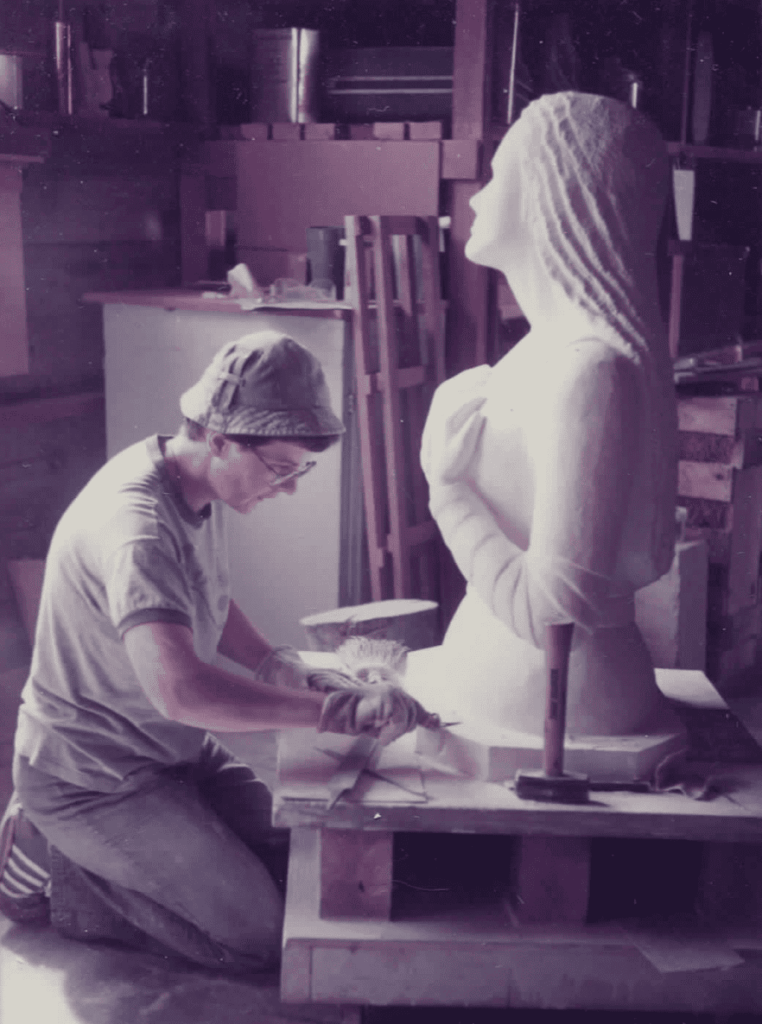 Barbara Hertel working on Mary sculpture
