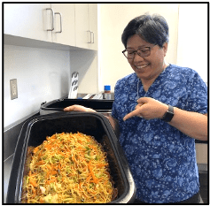 Sister Thuy Doan displays her pot of delicious noodles