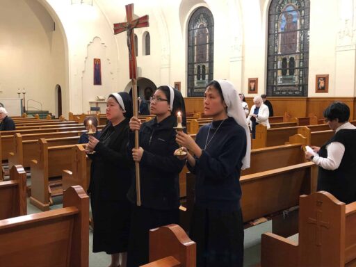 Sisters praying stations of the cross together