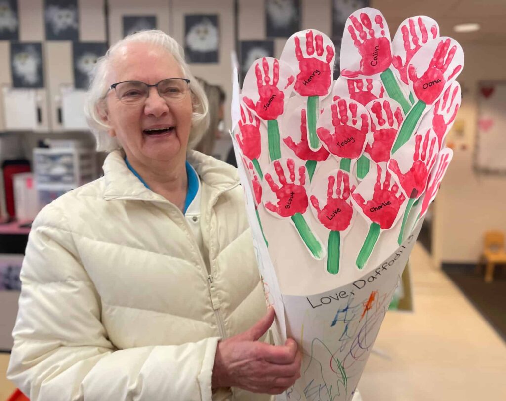 Sister Rita shows off a bouquet of crafted flowers