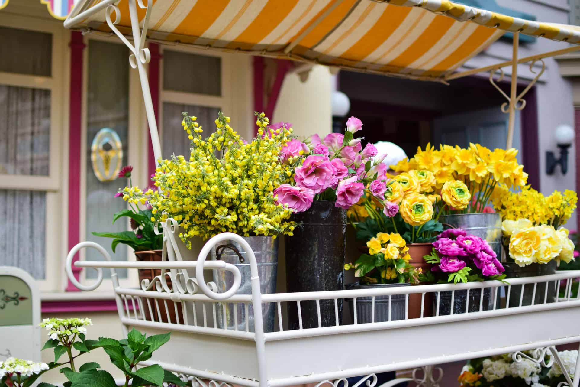 Various flowers arranged in a cart
