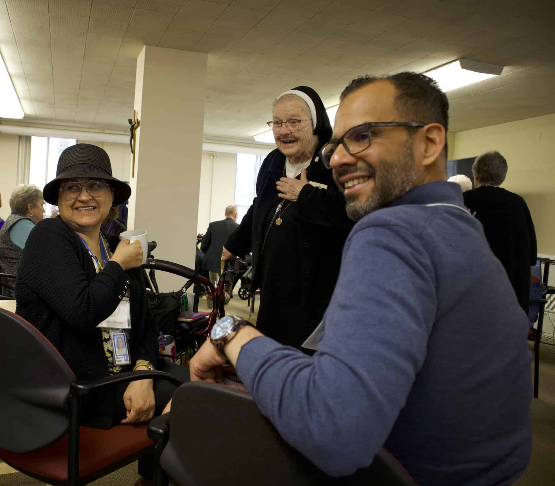 Sister Elma Heesacker with Catalina Huidor and Gabriel Franco.