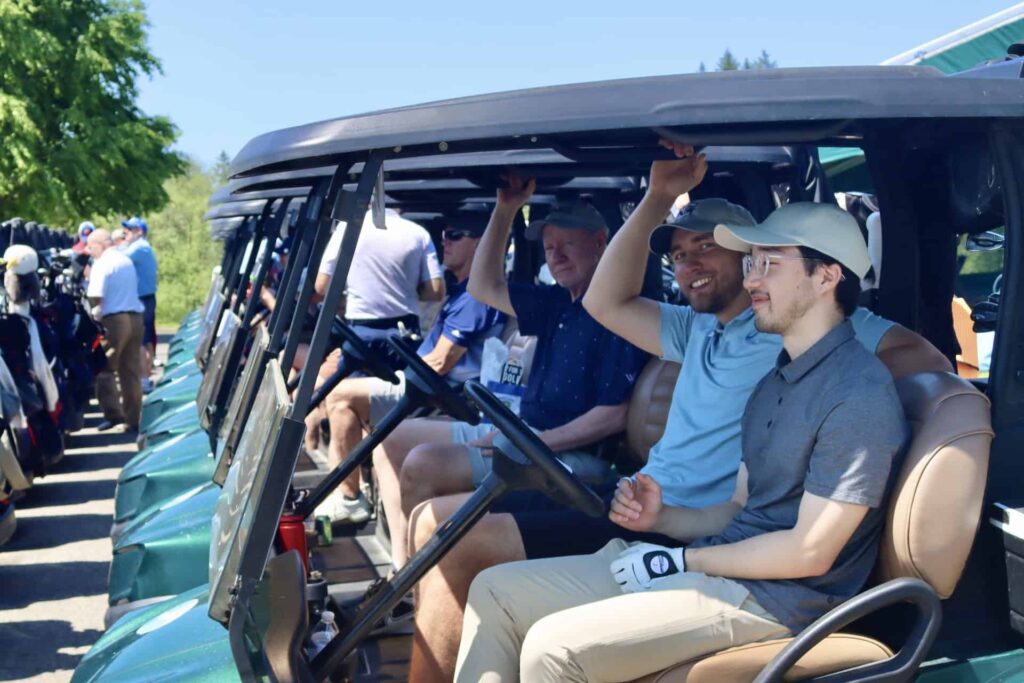 Golfers in carts ready to go