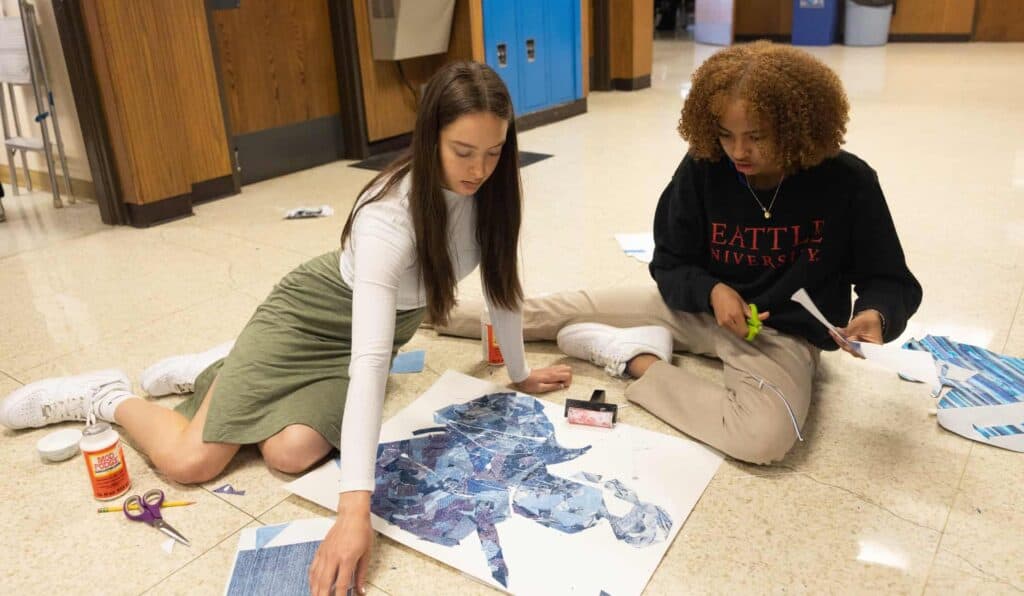 Student Body Officers working on a Mr. Valiant design