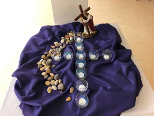 Votive candles, Jesus with cross - Palm Sunday