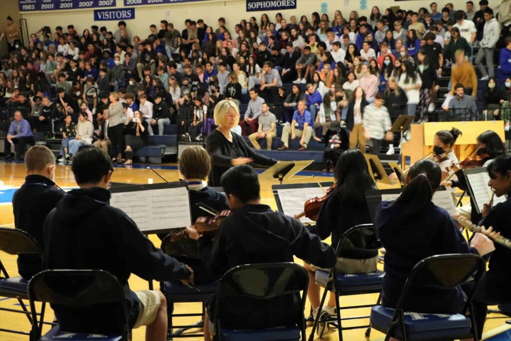 V C Orchestra performs at school assembly
