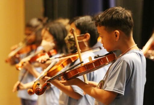 Music camp, kids playing the violin