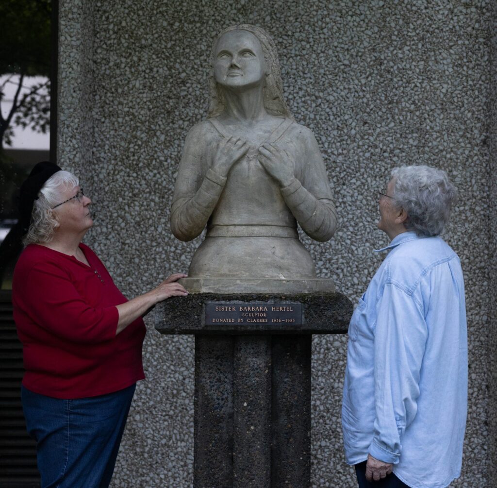 Barbara and Sr Catherine Hertel admiring statue
