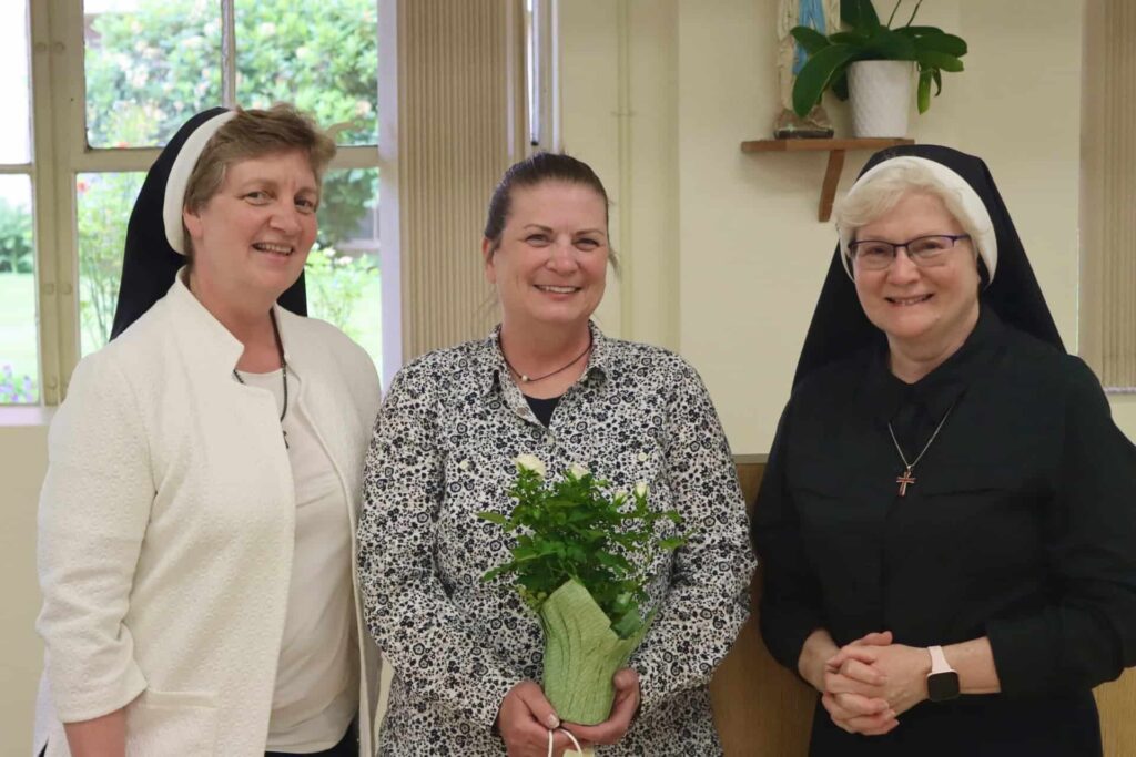 Srs. Michael Francine and Adele Marie celebrate Dr. Jen Gfroerer's 25 years of service