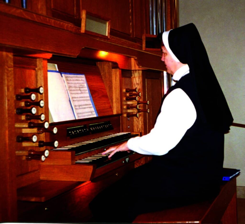 Sr. Juliana playing the organ, 1960s