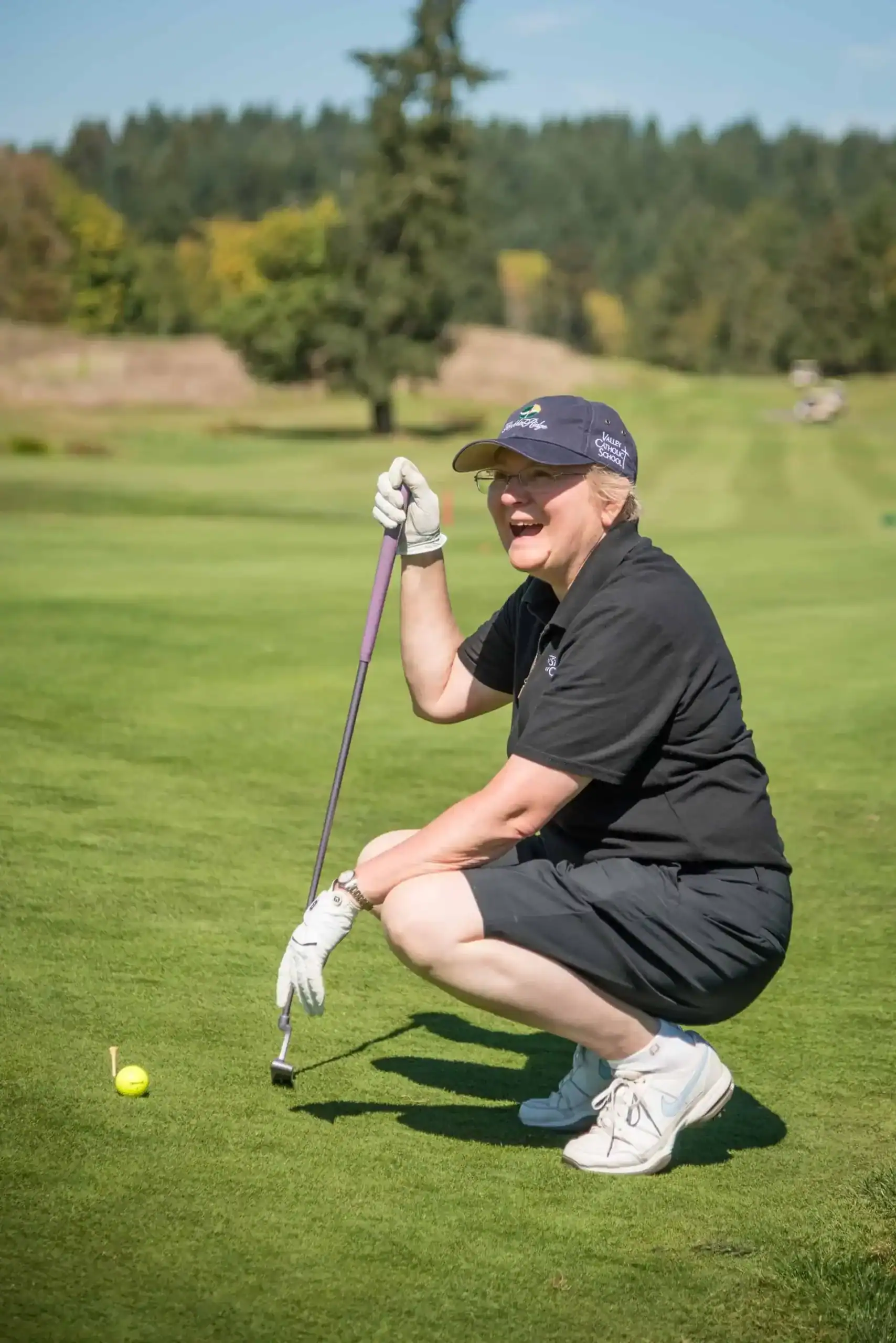 Sr Michael Francine measuring her golf shot