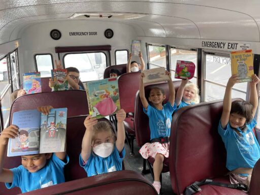 Early Learning School students with books on field trip
