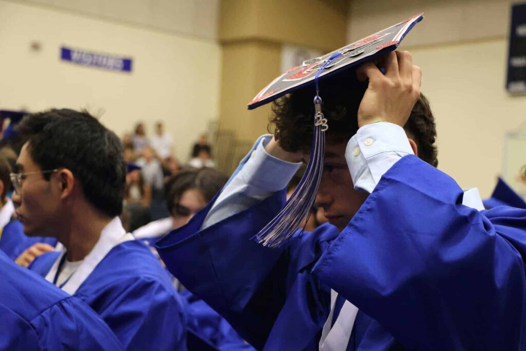 V C graduate is putting on his decorated cap