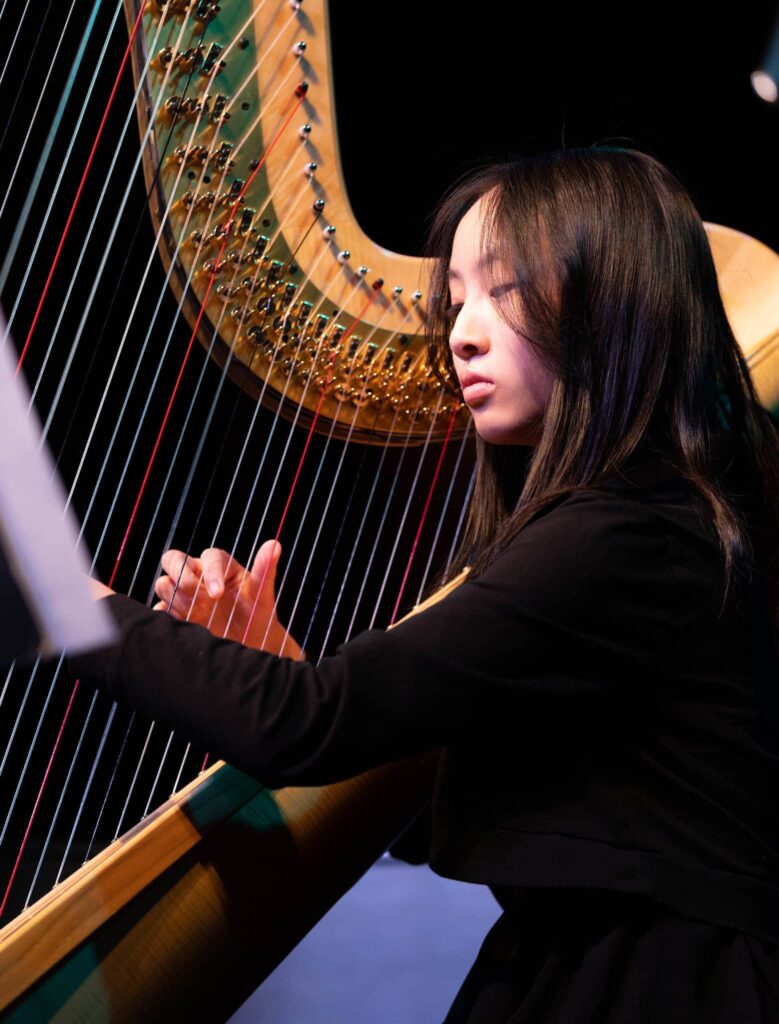 Music school student's harp performance