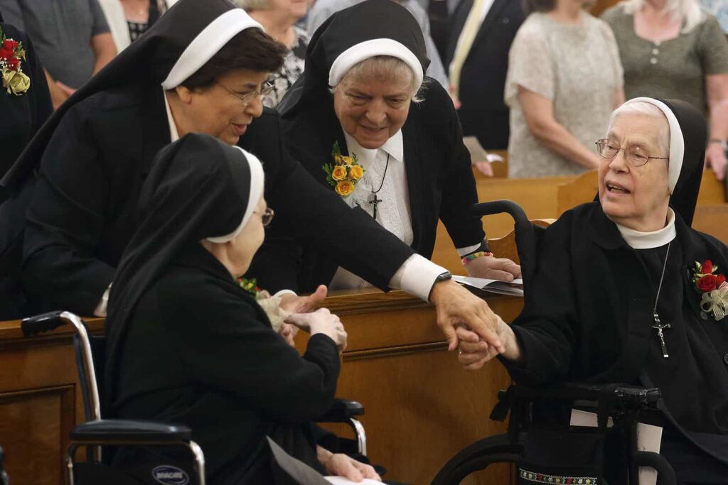 Peace greeting during Jubilee celebration