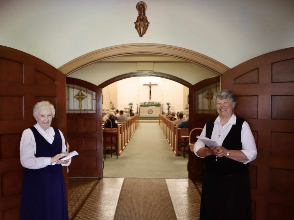 Srs. Patricia Marie and Charlene welcome guests to the Motherhouse Chapel