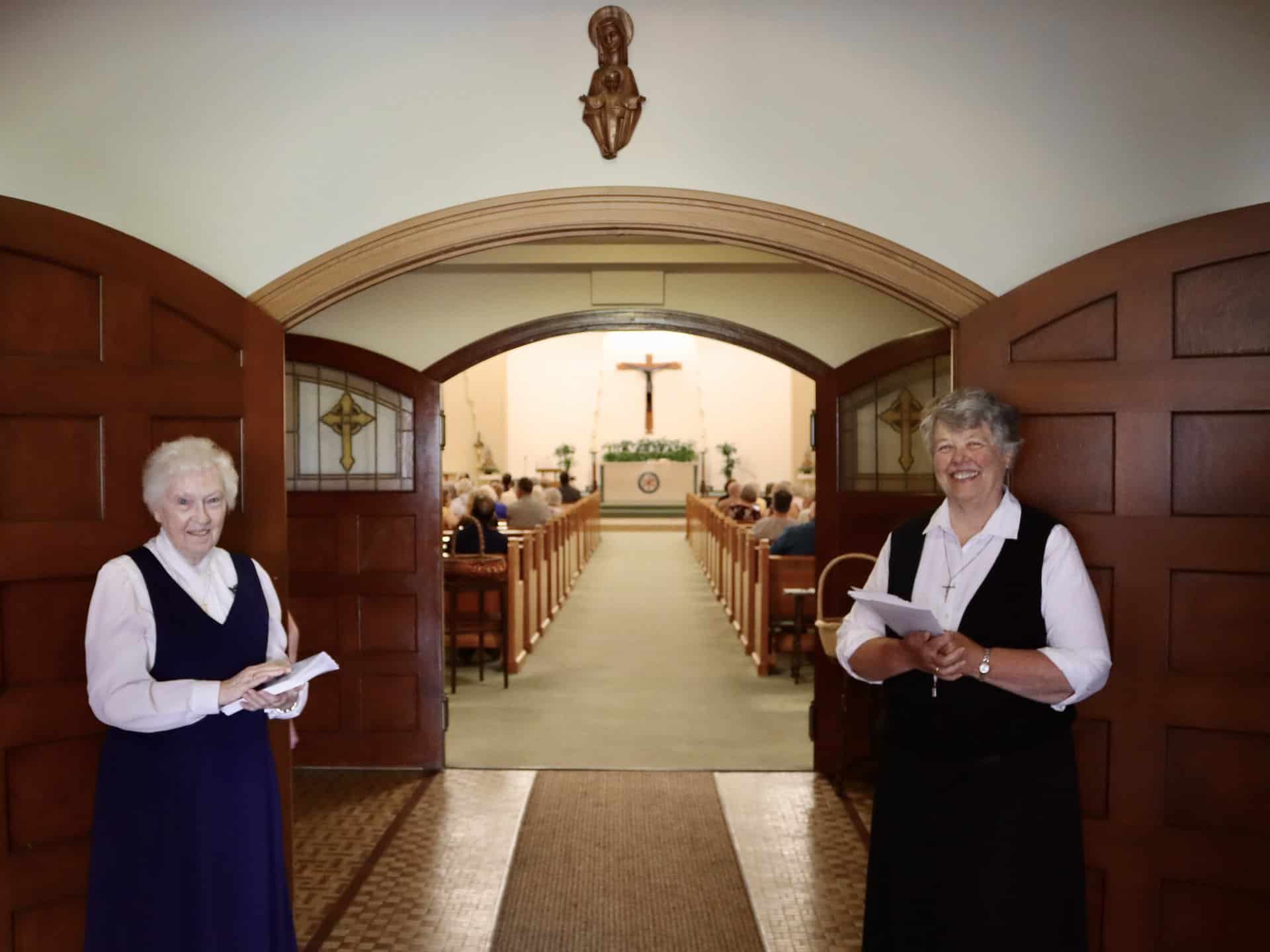 Srs. Patricia Marie and Charlene welcome guests to the Motherhouse Chapel