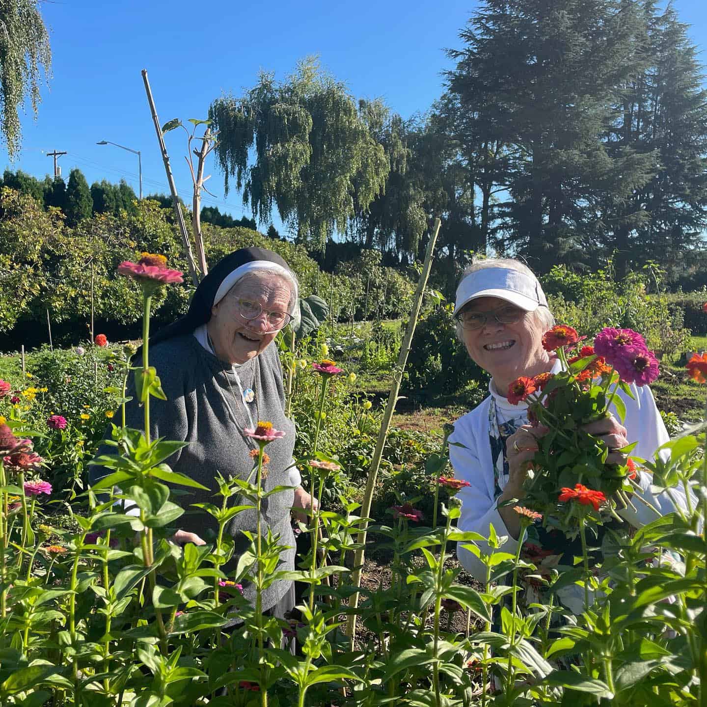 Sisters planting their flower garden