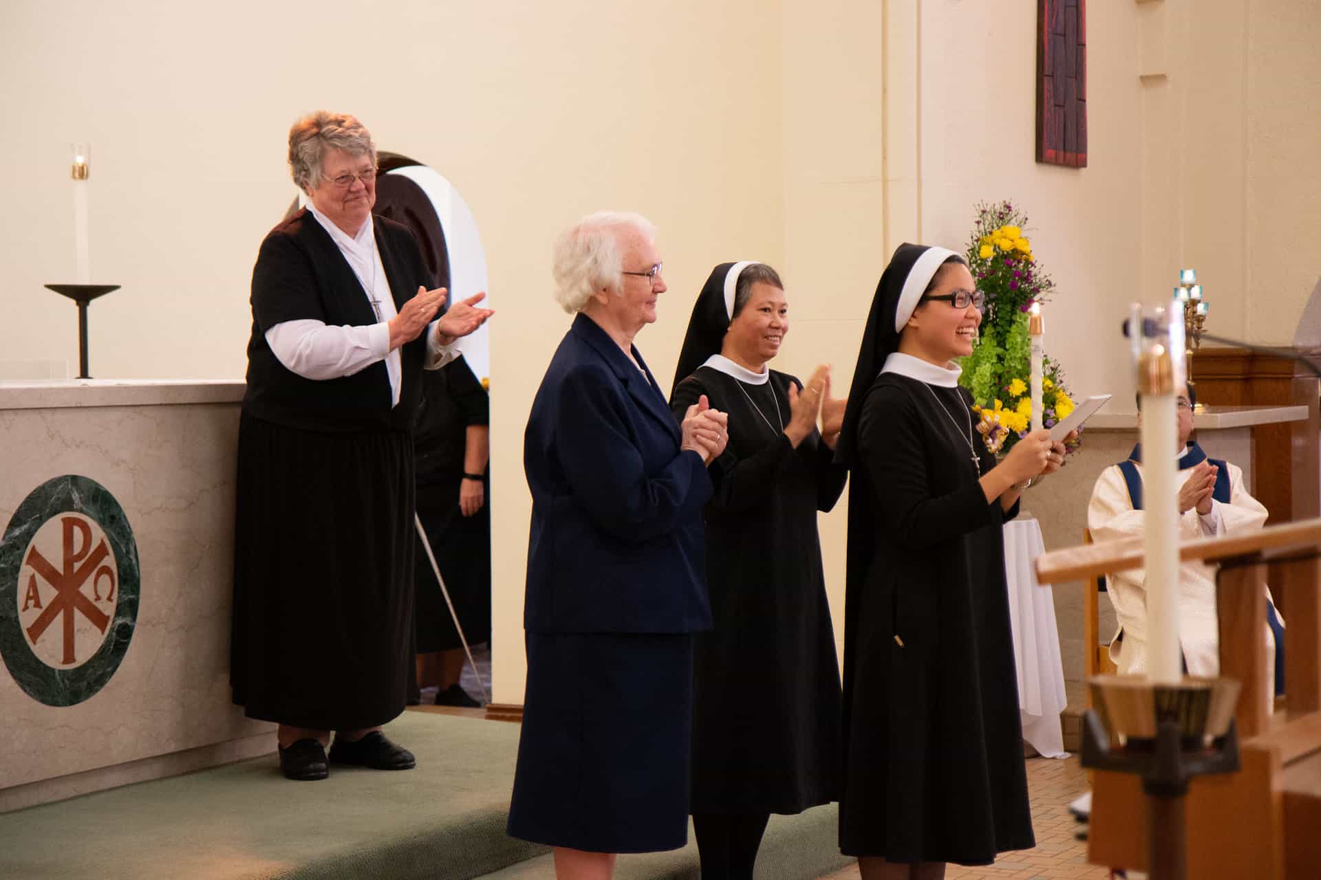 Sisters Charlene Herinckx and Maria Tran are all smiles during a reception