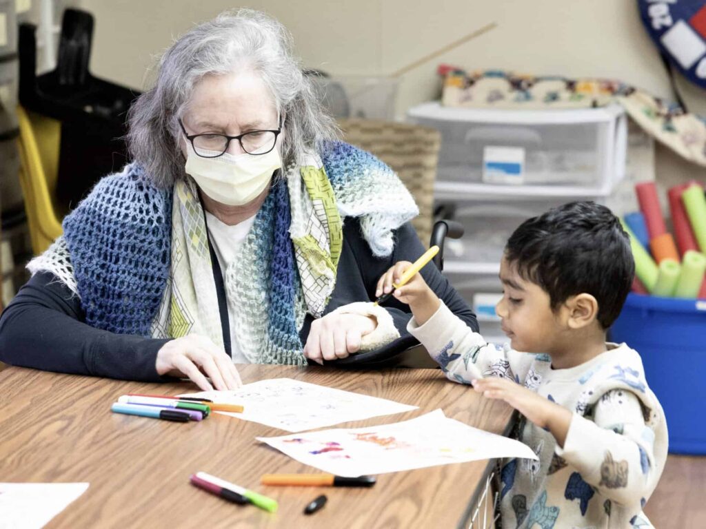 Early Learning School students and Maryville residents make greeting cards todather
