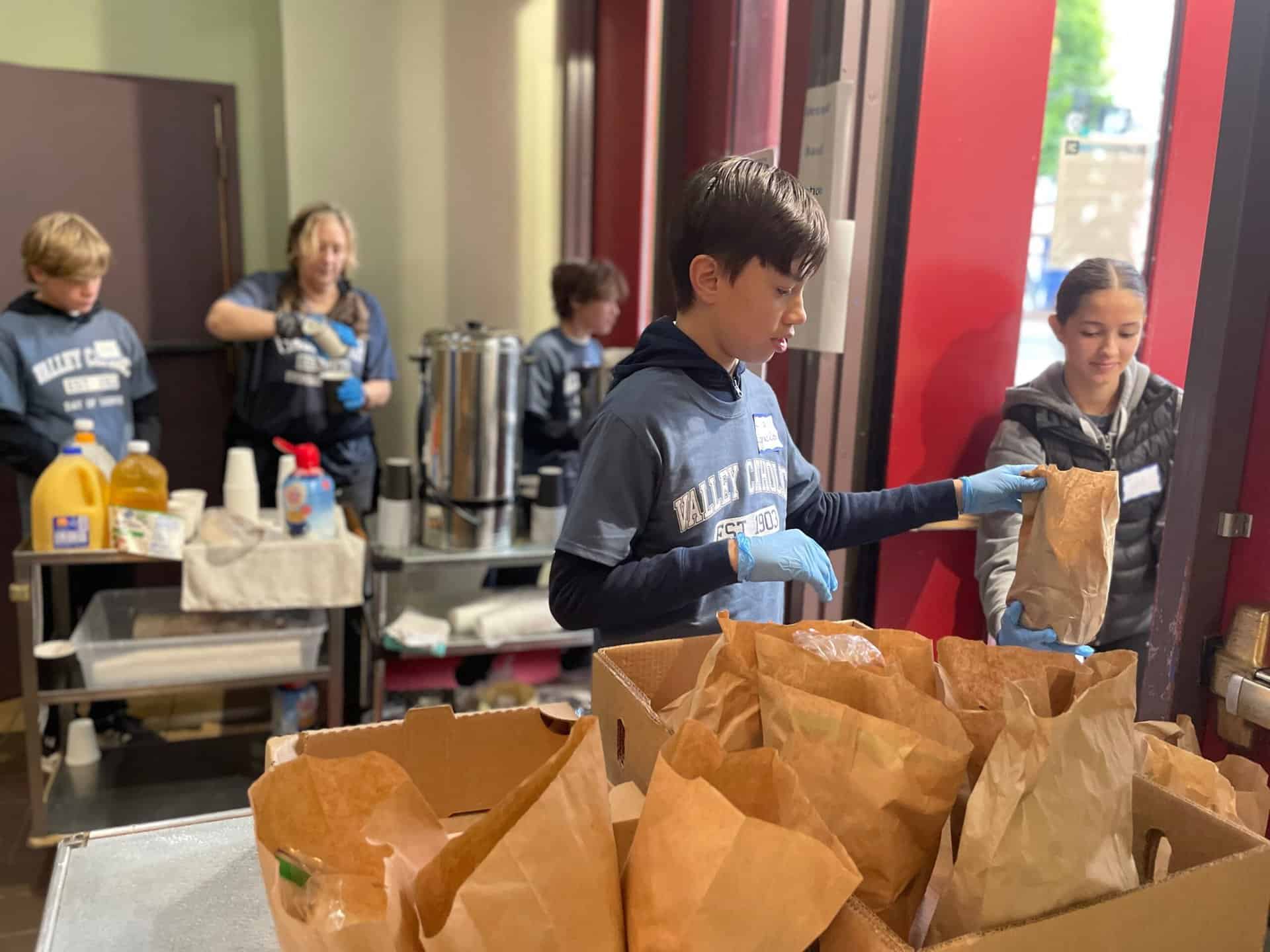 Handing out lunches at Day of Service