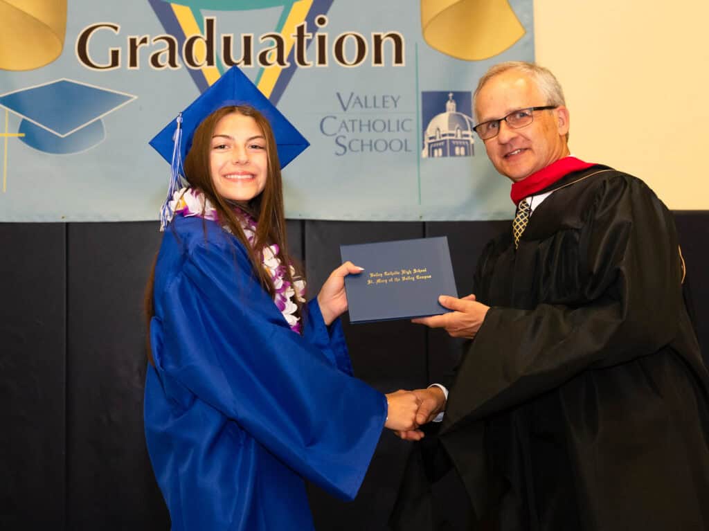 Grad photos with President John Matcovich