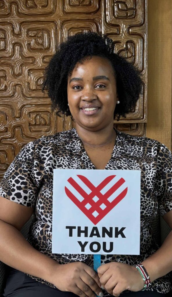 Irene with Thank you sign