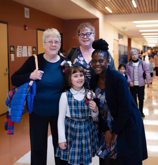 VCES student and her guests pose with Dr. Yvonne at Grandparents Day