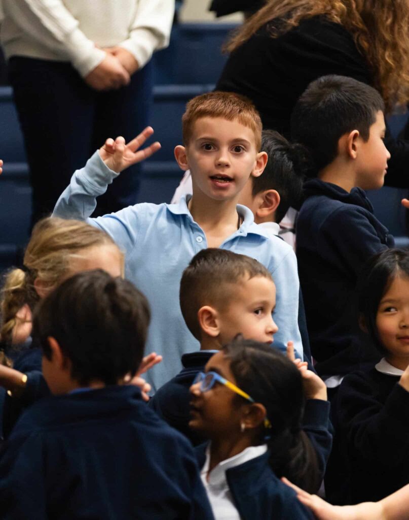 VCES students offering peace at Grandparents Day prayer service