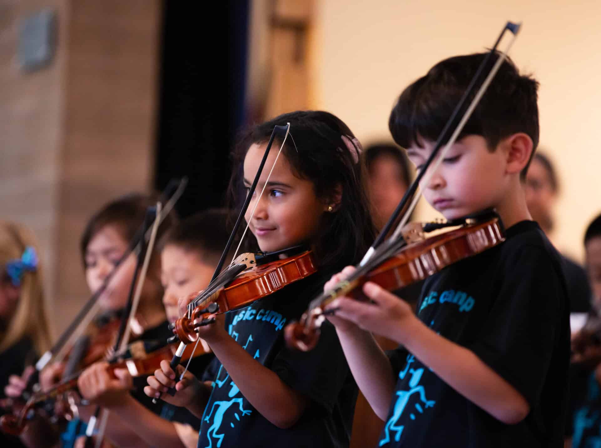 Kids playing violin at VC Summer Music Camp