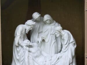 Refurbishing the stations of the cross. Sculpture depicts Jesus laying in the tomb.
