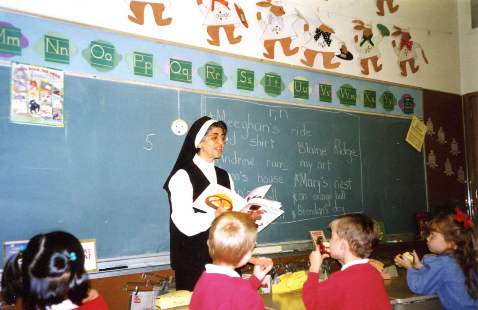Sr. Marie Bernadette George reading to her class.