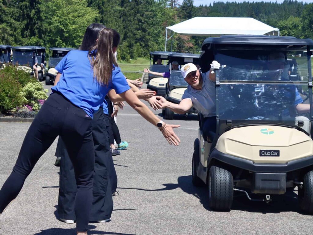 High fives on the way to the course at whole in one golf