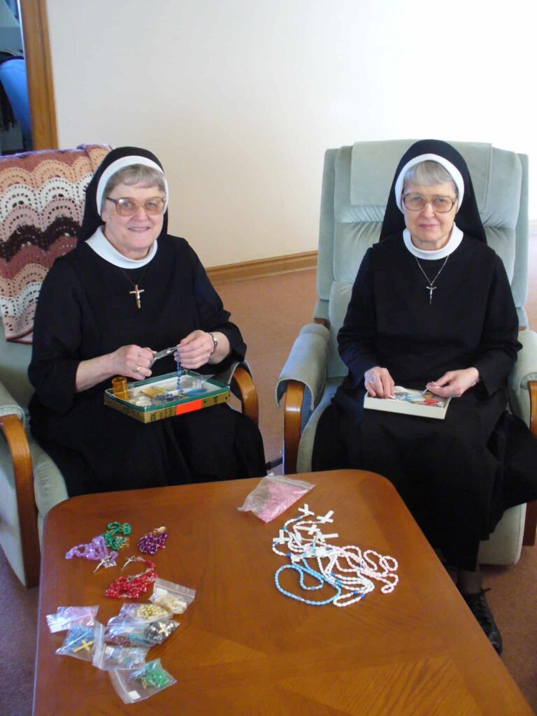 Sisters Theresa and Mary Ann Hathaway making rosaries