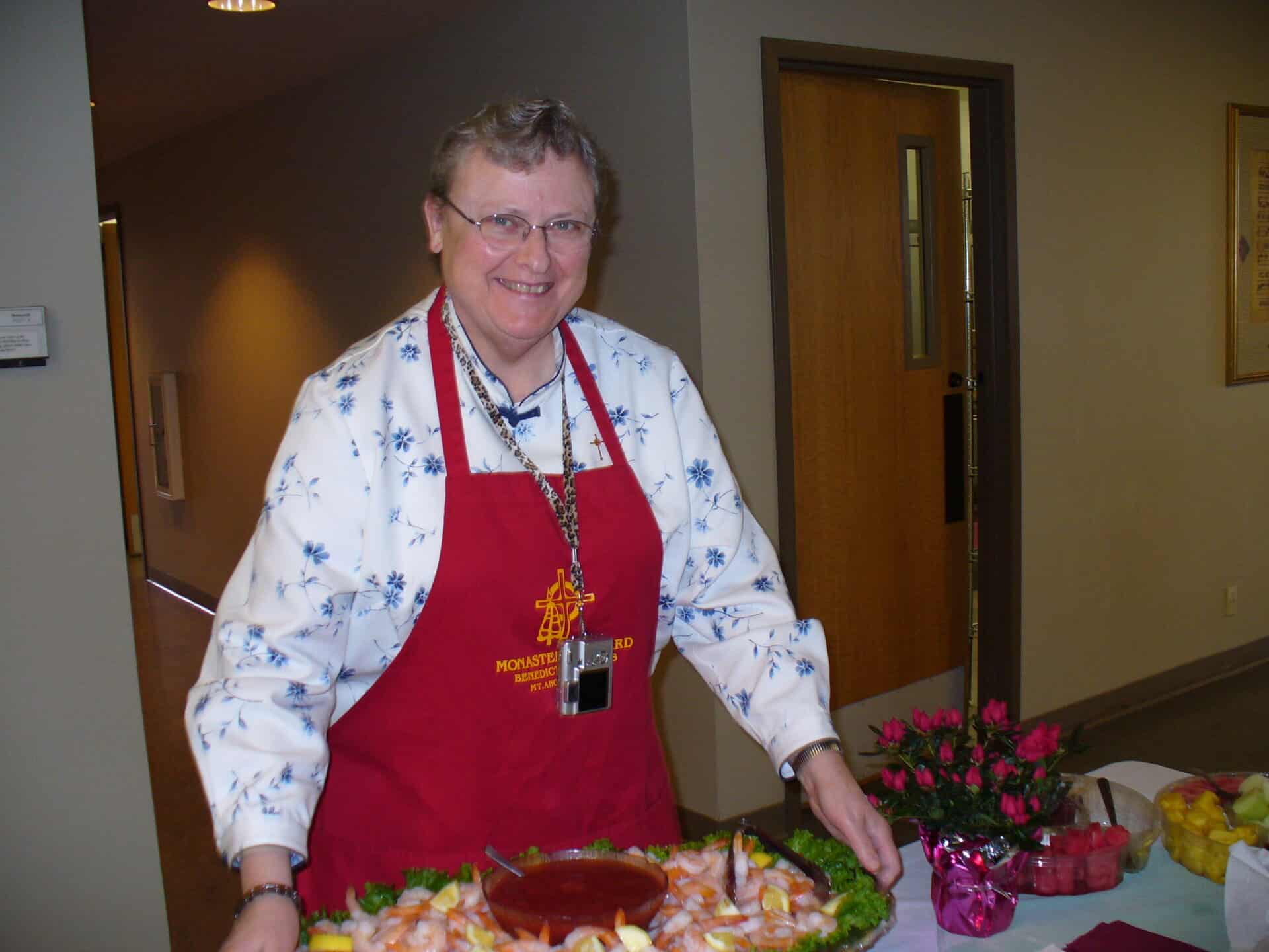 Sr. Marcella serving meals