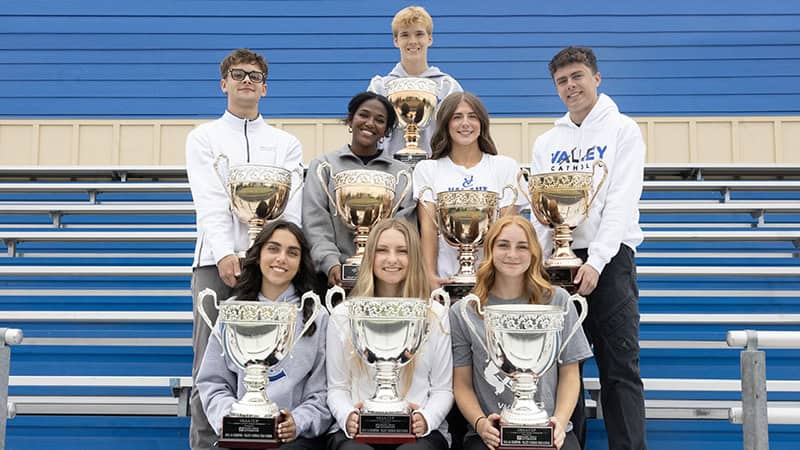 VCHS Students holding the eight OSAA Cups the school has won
