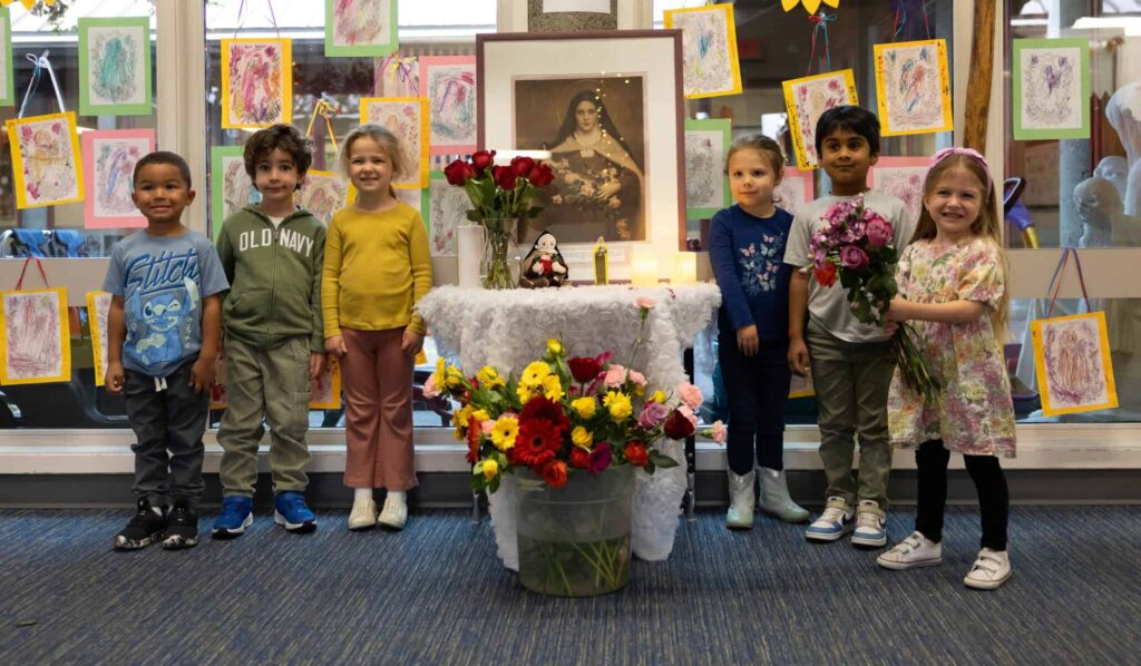 ELS students with flowers for St. Therese