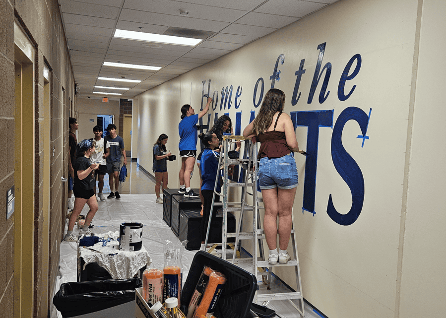 VCHS grads working on valiant mural